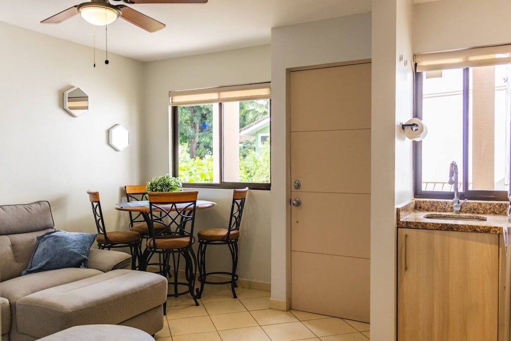 Cozy Condo with Panoramic Hillside Views from Rooftop Terrace and Short Walk to Beach