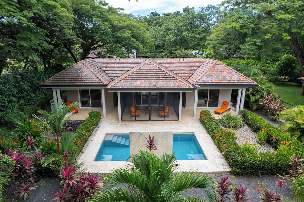 Beautiful home in a gated Neighborhood, Walking Distance to Beach with Garden