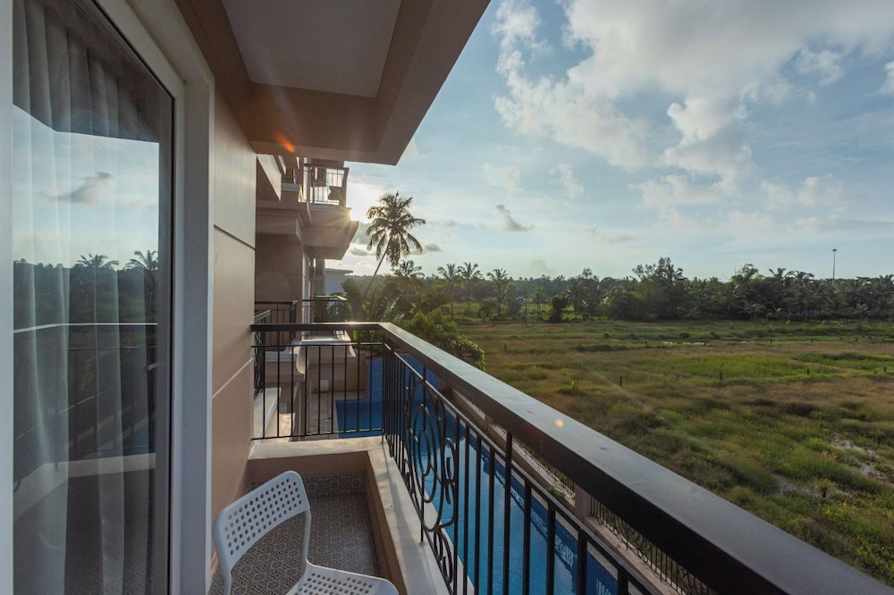 Palm Retreat 1BHK Pool & Field Views