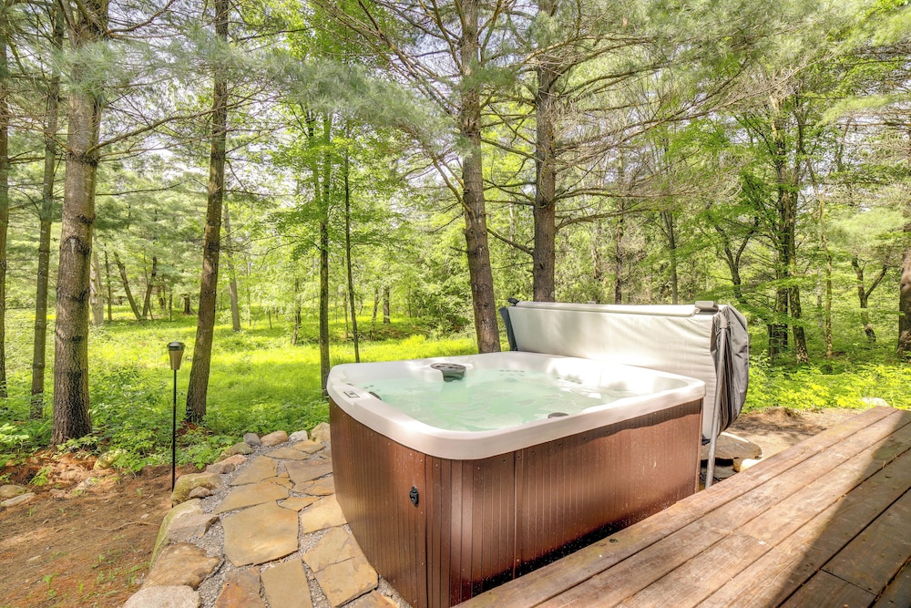 Secluded Log Cabin in NW Michigan: Hot Tub Deck - Property Image 6