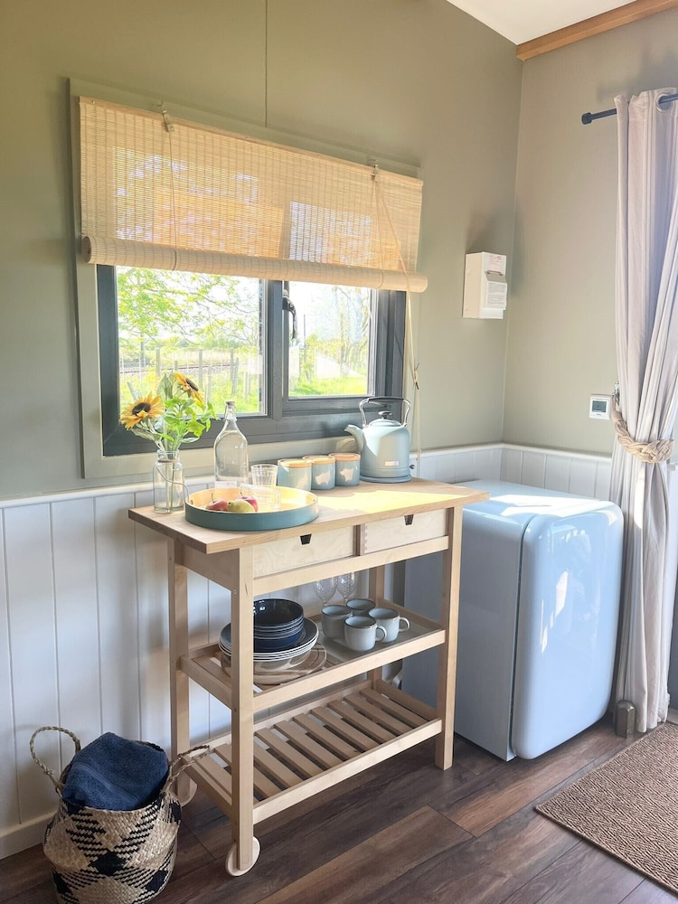1br-sleeps2-field View-parking-cabin Experience view 2