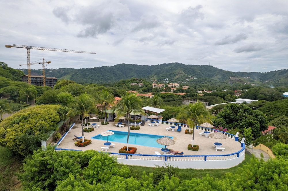 Modern Top-Floor Condo with Panoramic Views and Community Pool