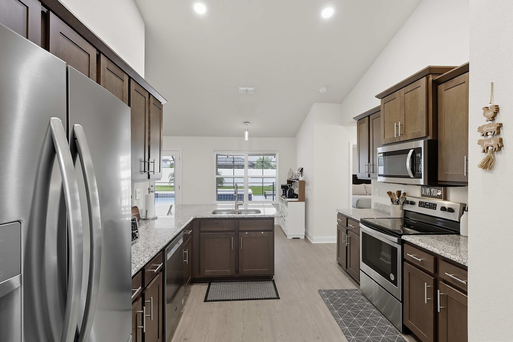Modern 4BR Retreat Near Beach Heated Pool