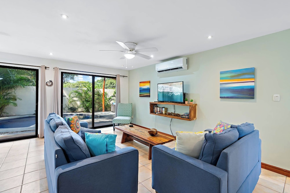 Inviting Home with Colorful Decor and Private Backyard Oasis with a Swimming Pool & Shaded Terrace