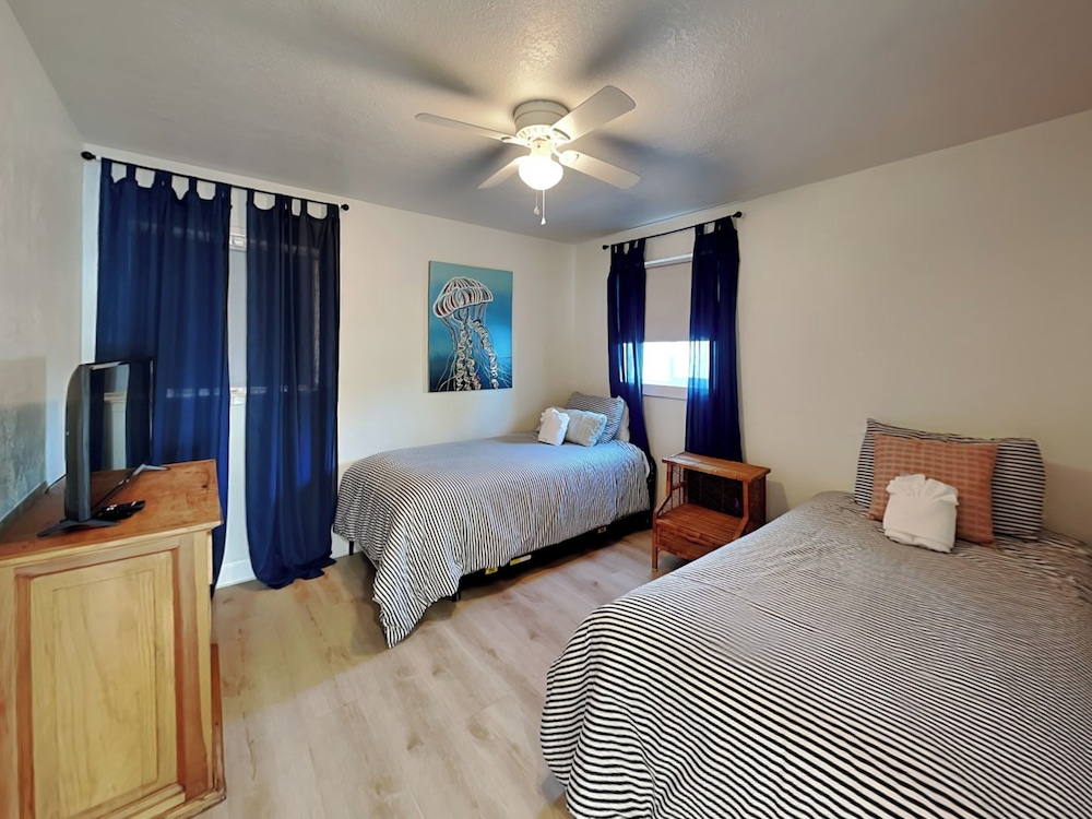 Bathing Suit Beach Bungalow by Distinctive Beach Rentals