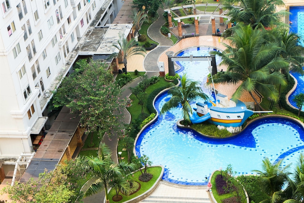 Monochrome Style 2 Bedrooms at Kalibata City Apartment By Travelio