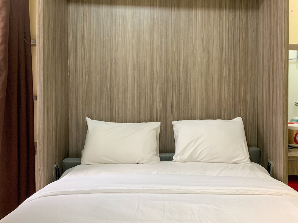 Homey And Tidy Studio At Green Pramuka City Apartment view 2