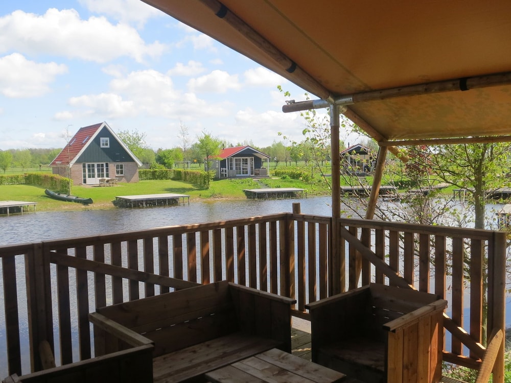 Campsite - Combined Tents With Kitchen and Bathroom Located Near a Pond