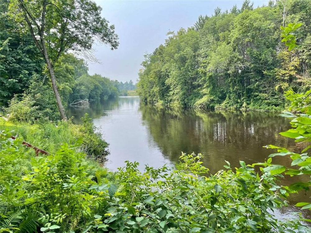 Whispering Pines Riverside Getaway