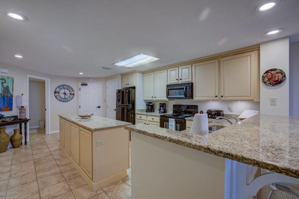 Stunning Ground Floor Condo With Lush Lawn Overlooking White Sands view 4