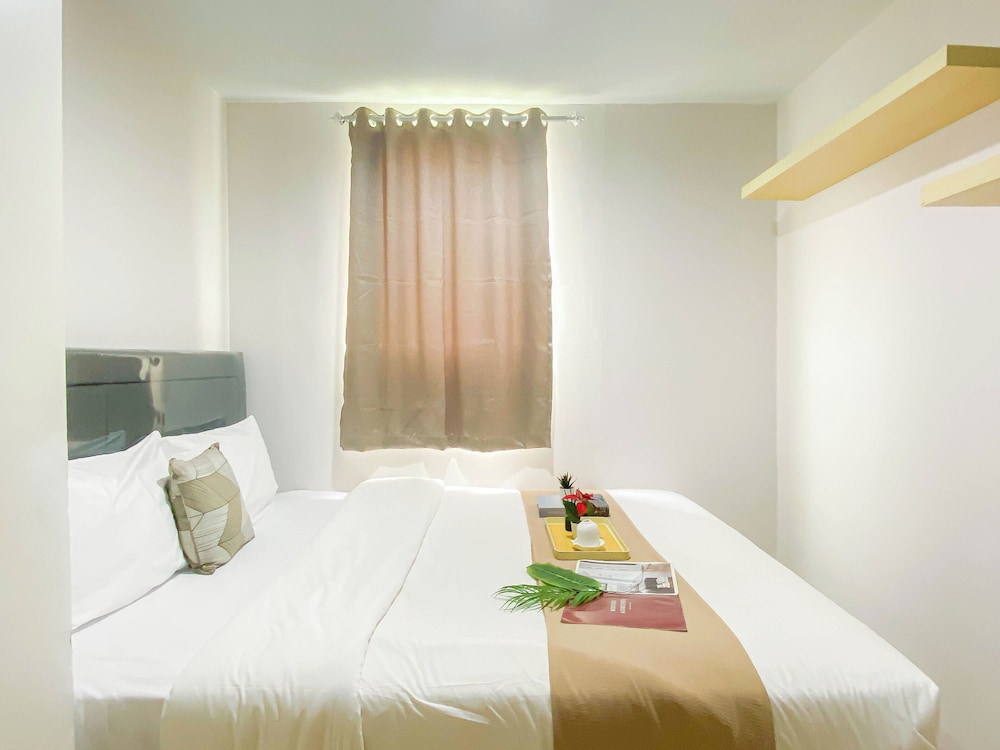 Simple 2Br At Azalea Suites Apartment