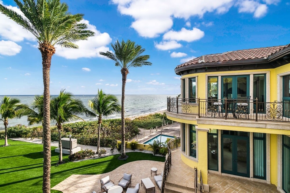 Luxurious 3-story Estate With Gym Pool Slide Private Beach and Lighthouse Views