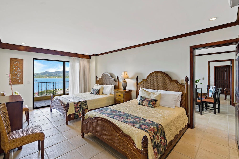 Remodeled Top-Floor Condo with Stunning Wrap-Around Balcony Offering Mountain, Ocean & Marina Views