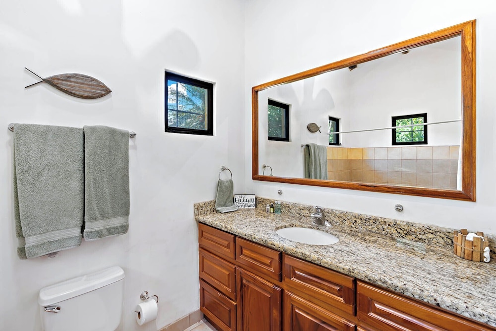 Inviting Home with Colorful Decor and Private Backyard Oasis with a Swimming Pool & Shaded Terrace