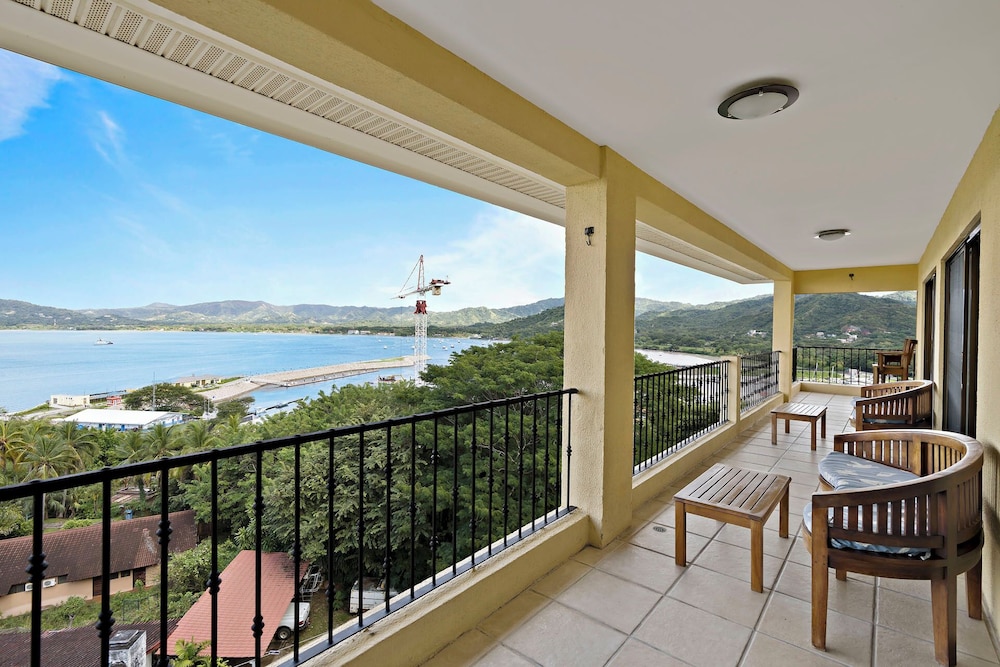Remodeled Top-Floor Condo with Stunning Wrap-Around Balcony Offering Mountain, Ocean & Marina Views