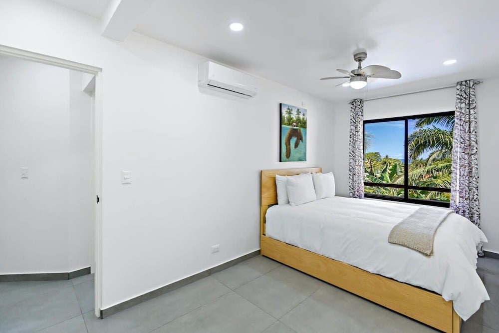 Modern Split-Level 2-Bedroom Condo with Pools, Terrace & Easy Beach Access