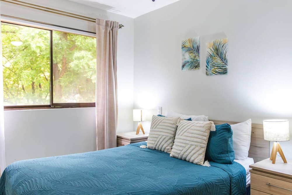 Cozy Condo with Panoramic Hillside Views from Rooftop Terrace and Short Walk to Beach