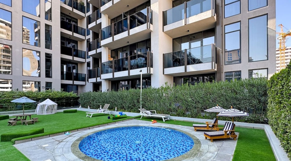 Stylish 1BR Apt w Pool in JVC nr Dubai Sports City