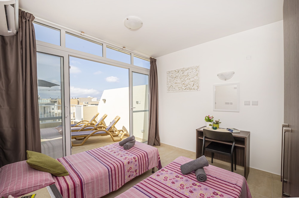 Summer Breeze Penthouse with large Terrace and Hot Tub by Getaways Malta view 5