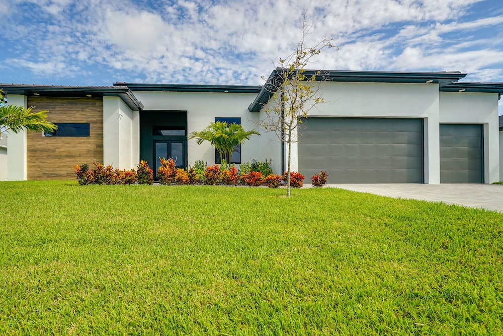 Pool & Outdoor Kitchen: Waterfront Cape Coral Home view 3