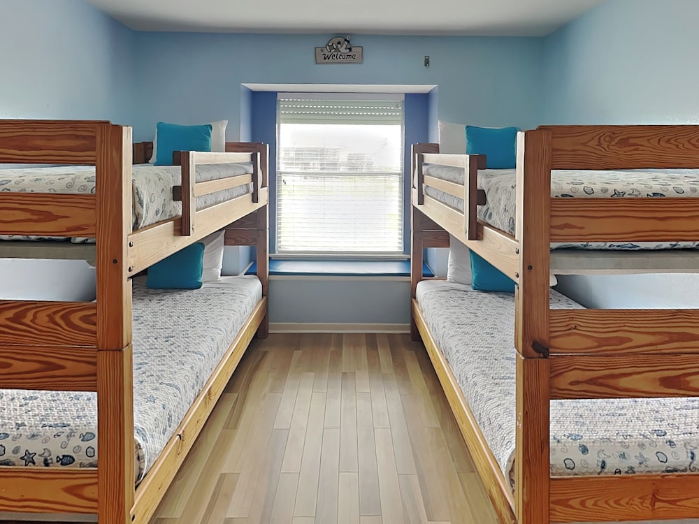 Whispering Sands Beachfront by Ryson Vacation Rentals