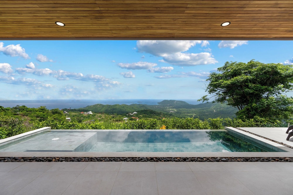 Mountainside Home with Modern Design, Sweeping Ocean Views & Private Swimming Pool