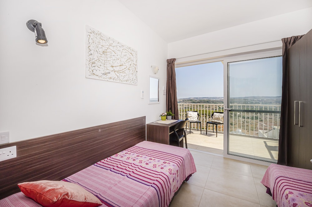 Summer Breeze Penthouse with large Terrace and Hot Tub by Getaways Malta view 3