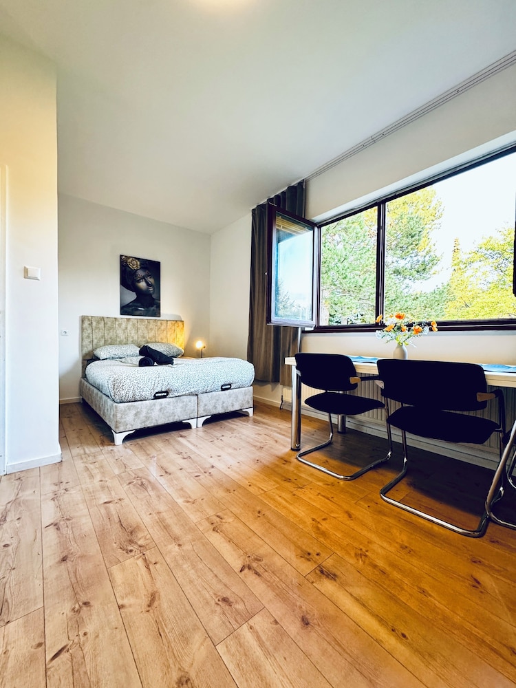 Central 8BR Stay with Garden and Terrace