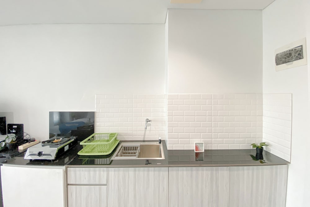 Simple White Designed Studio At Lrt City Bekasi Apartment