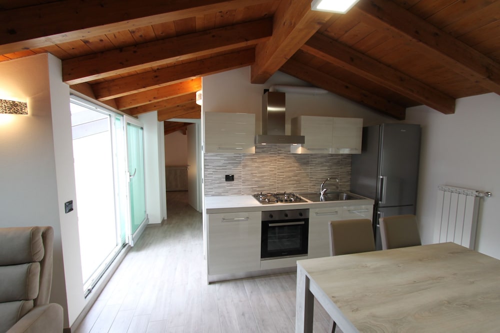 Attic with Pool en Nesso — kitchen