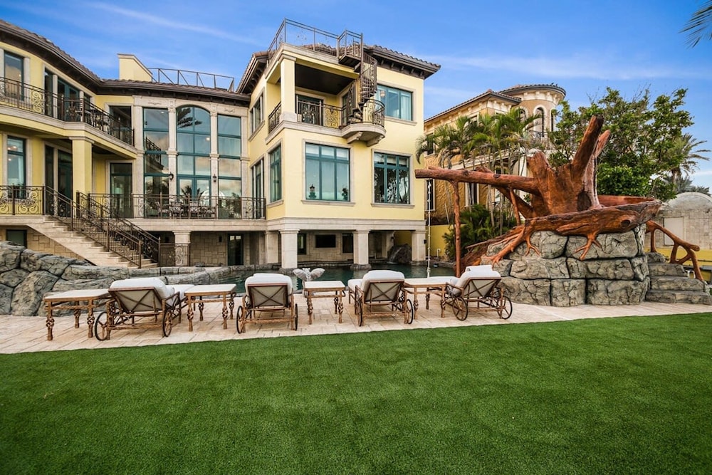 Luxurious 3-story Estate With Gym Pool Slide Private Beach and Lighthouse Views
