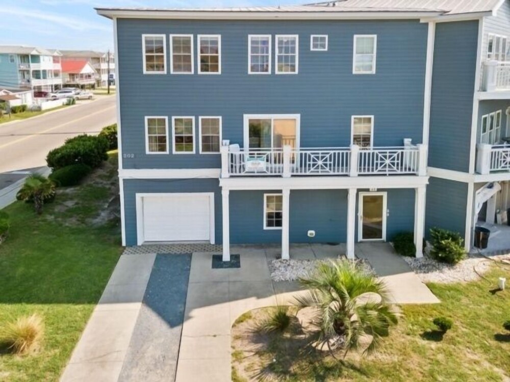 Kure Beach Villa - Enjoy Three Levels Of Luxury! Outdoor Pool And Garage Parking! 2 Bedroom Townhouse by RedAwning