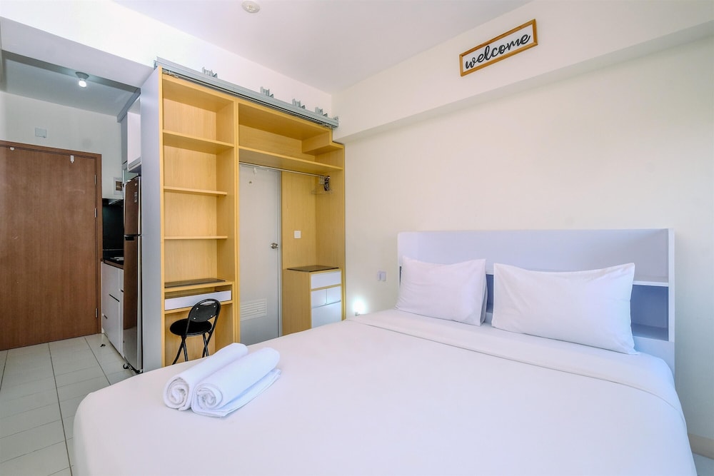 Warm and Cozy Design Studio at Podomoro Golf View Apartment