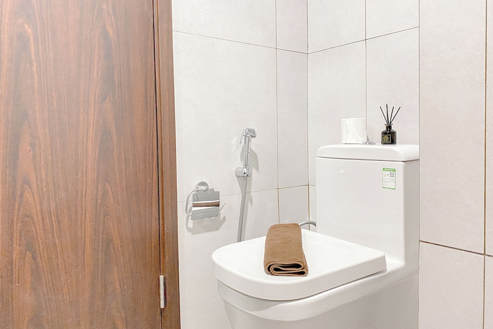 Simple White Designed Studio At Lrt City Bekasi Apartment