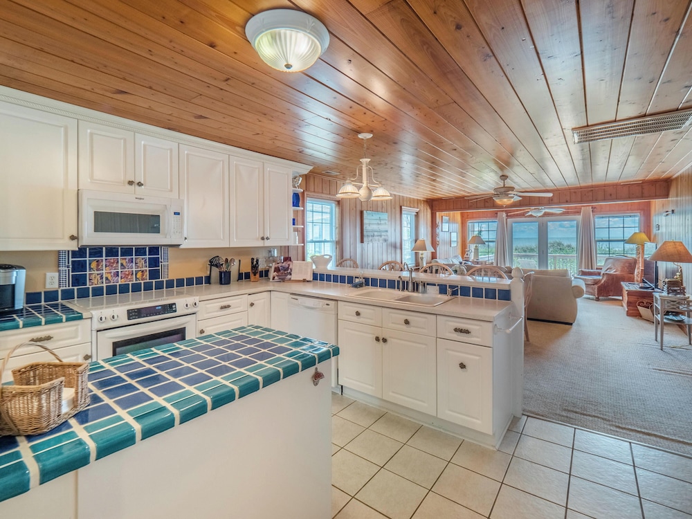 A Charm of Finches by Topsail Realty