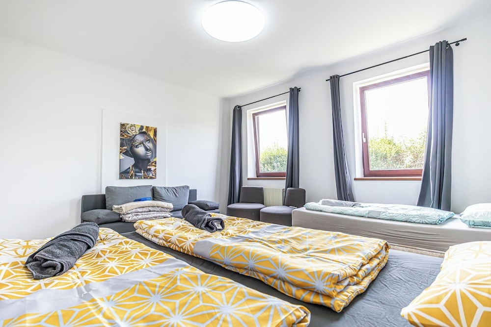 Cozy 3BR Apt with Garden Sleeps 10