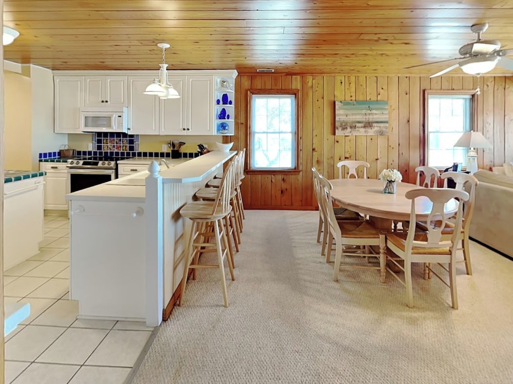 A Charm of Finches by Topsail Realty