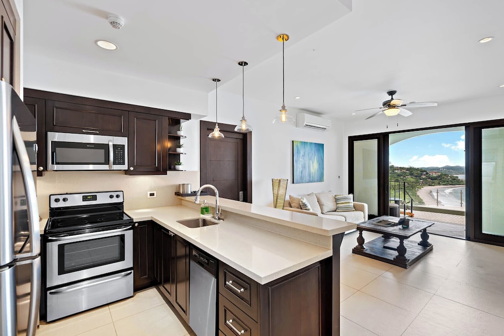 Luxury Condo with Panoramic Ocean Views, Sparkling Infinity Pool, and Modern Open-Concept Design