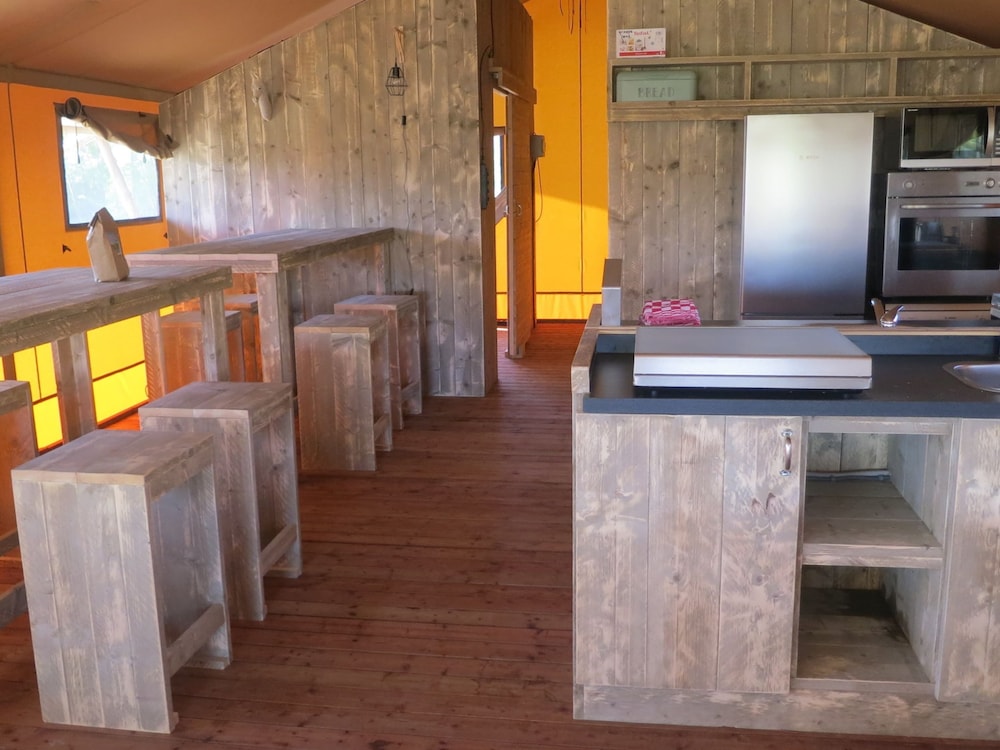 Campsite - Combined Tents With Kitchen and Bathroom Located Near a Pond