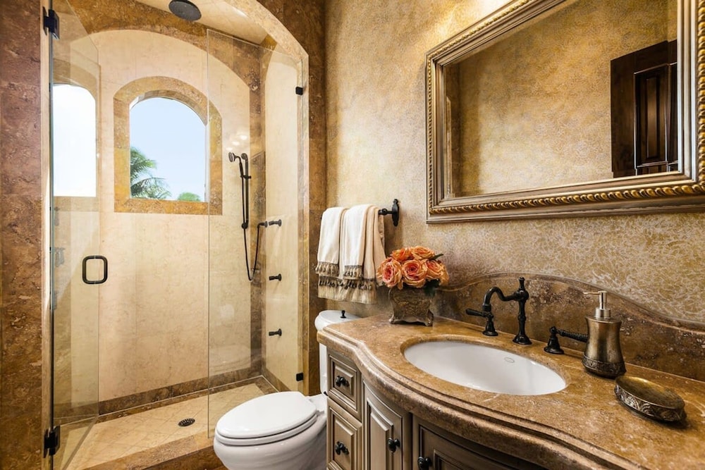 Luxurious 3-story Estate With Gym Pool Slide Private Beach and Lighthouse Views