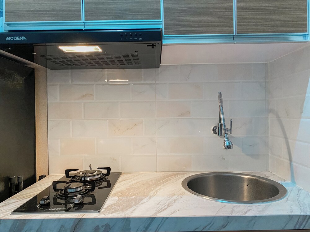 Warm and Homey Studio at Podomoro Golf View Apartment