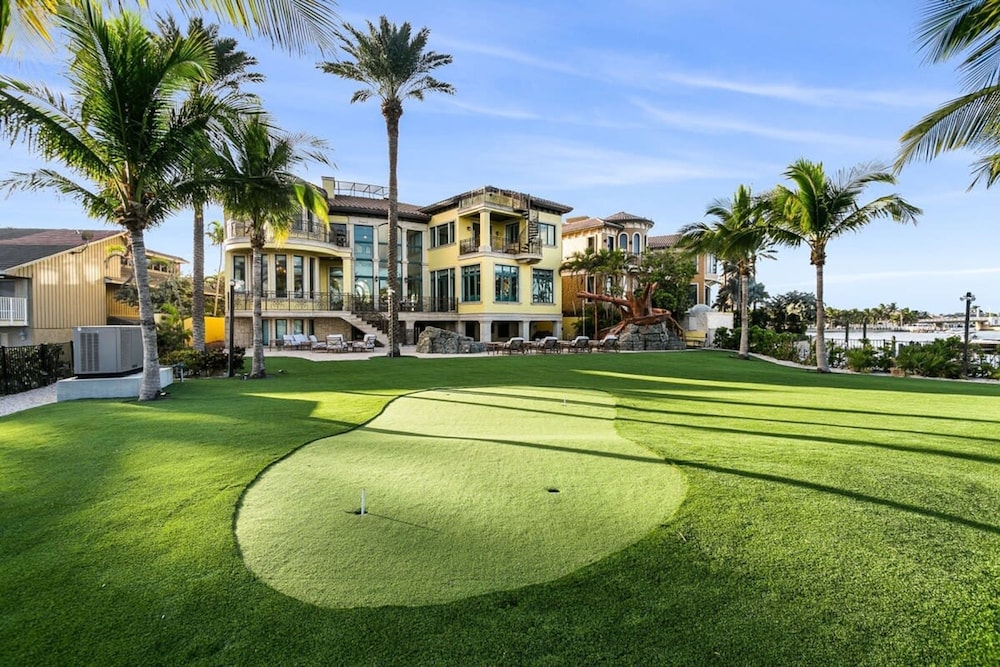 Luxurious 3-story Estate With Gym Pool Slide Private Beach and Lighthouse Views