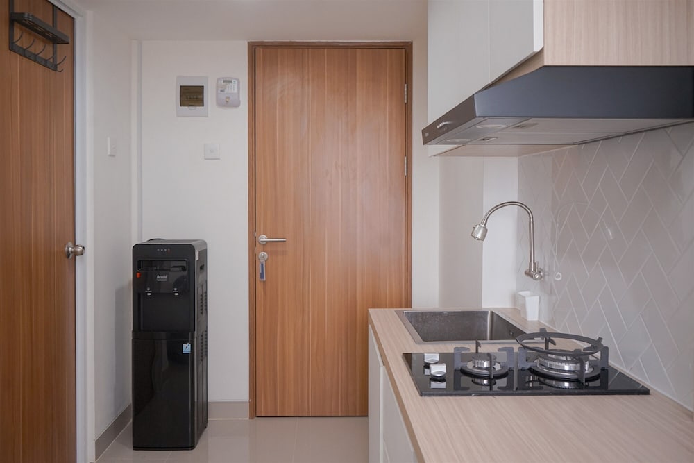 Minimalist And Warm Studio Room At Cisauk Point Apartment