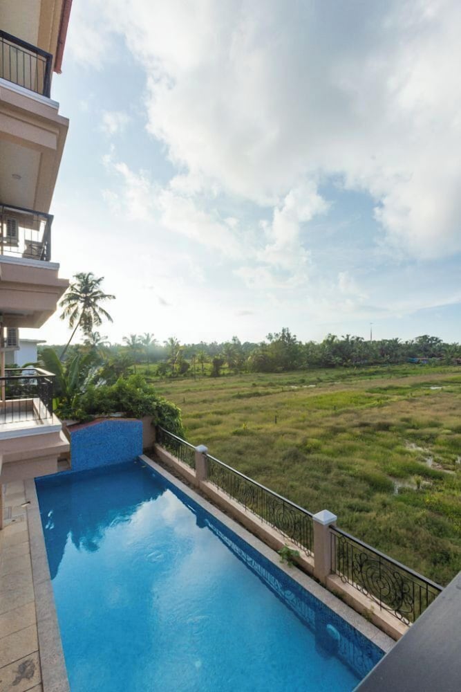 Palm Retreat 1BHK Pool & Field Views