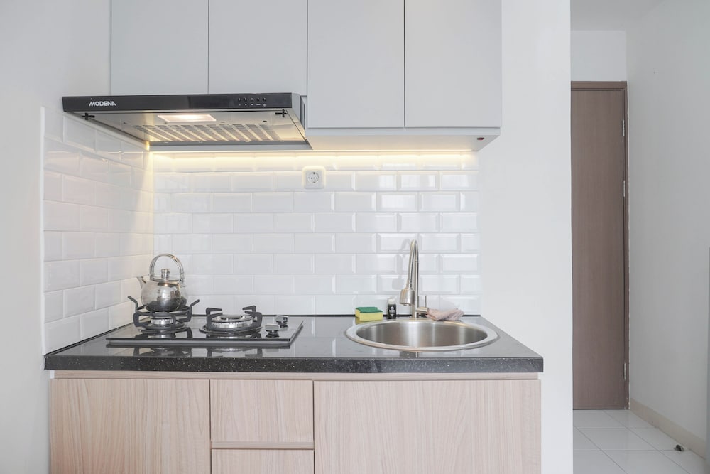 Homey and Minimalist 2BR at Podomoro Golf View Apartment