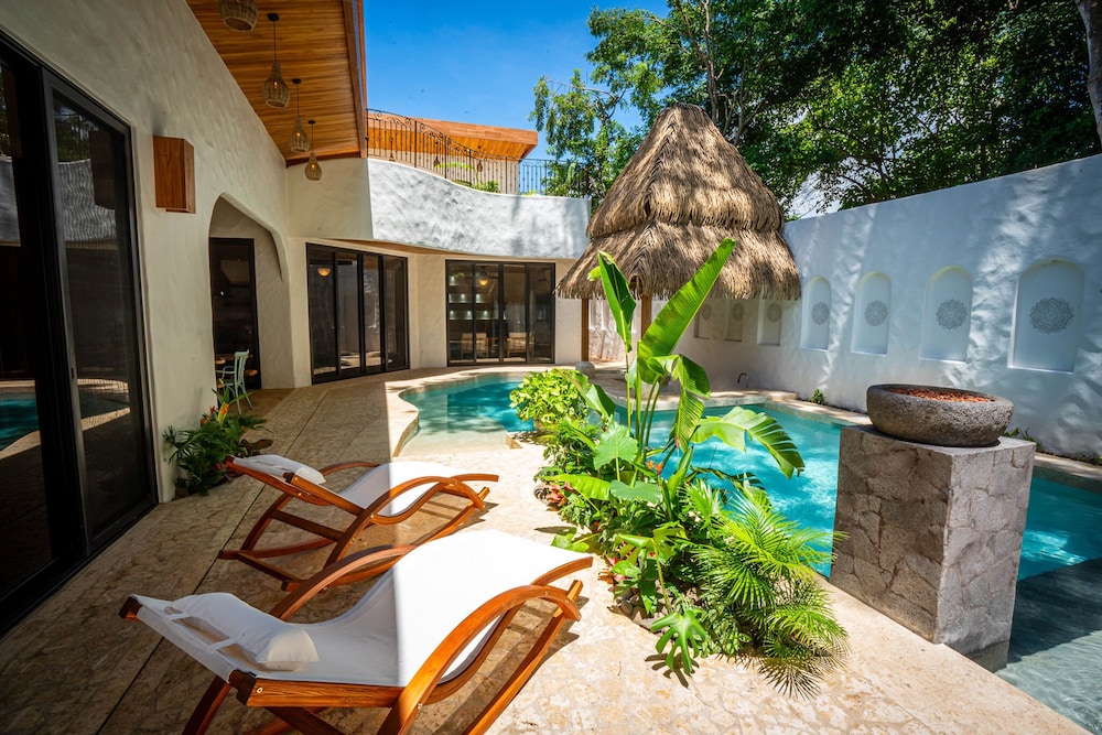 Bohemian Tropical Villa with a Tiki-Style Swimming Pool & Swim-Up Bar with an Attached Studio Apartment