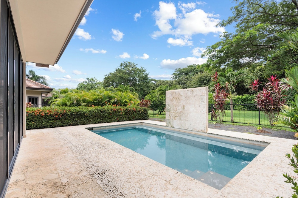 Beautiful home in a gated Neighborhood, Walking Distance to Beach with Garden