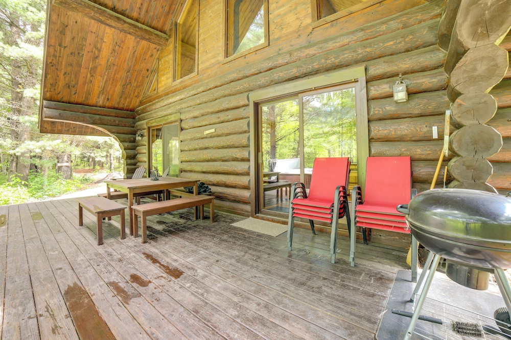 Secluded Log Cabin in NW Michigan: Hot Tub Deck - Property Image 7