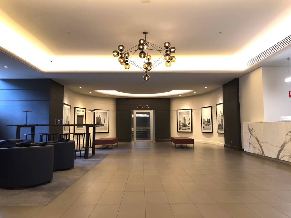 Unwind in Style at Melbourne's Historic Art Deco Apartment With Pool Gym Carpark