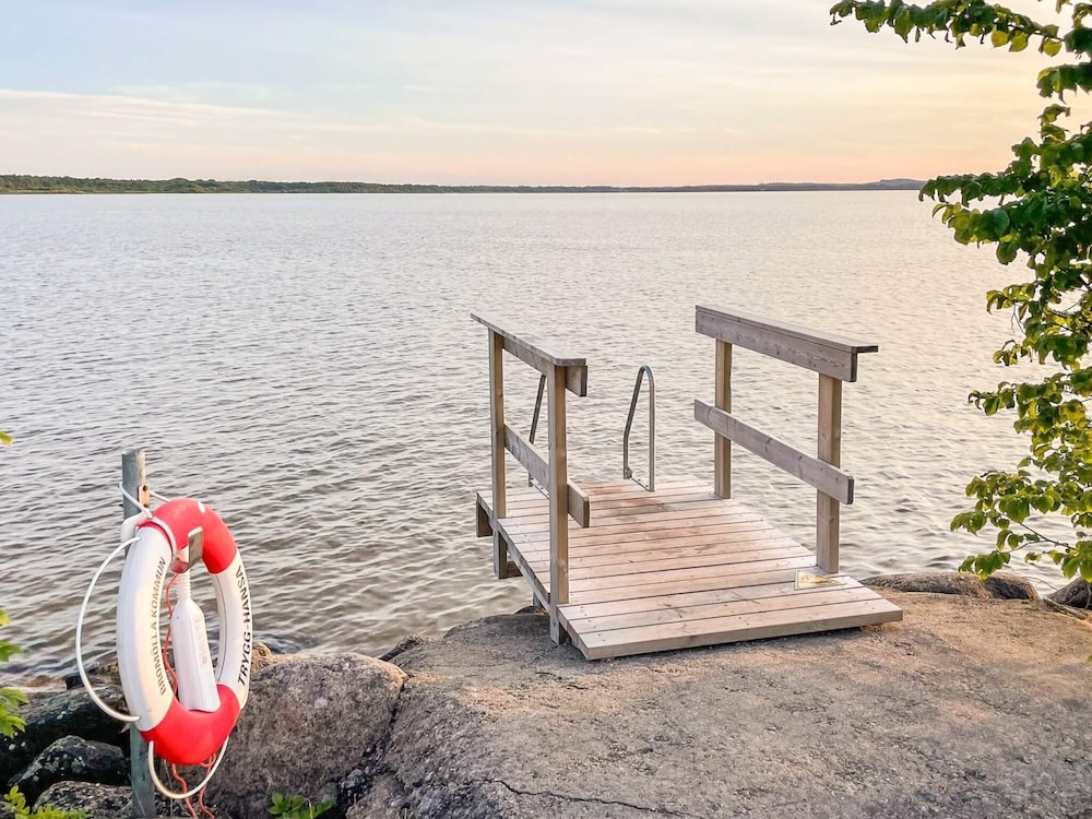 Serene Lakehouse With Rowing Boat